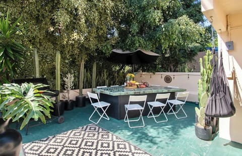 Start your mornings with breakfast beneath the trees, spend the afternoon enjoying Mexico City's perfect weather, and gather here for unforgettable dinners and drinks with family and friends. This spacious private terrace is truly the heart of Casa L