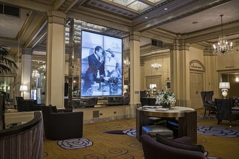 Wander through an opulent lobby with art and glow.