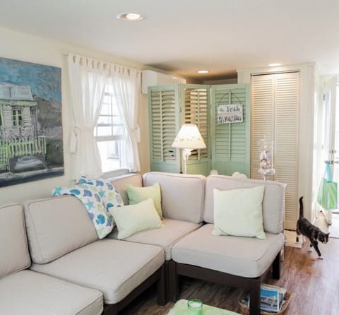 Family Room with Laundry area behind screen