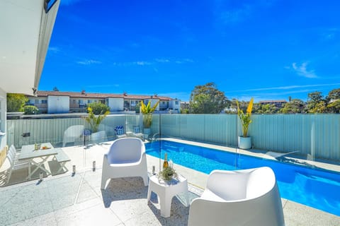 Enjoy long sunny afternoons by the pool with outdoor dining and plenty of space to relax and entertain.