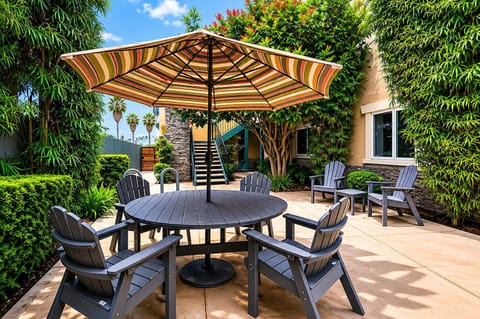 Gather outside under the umbrella and enjoy the sunshine ☀️