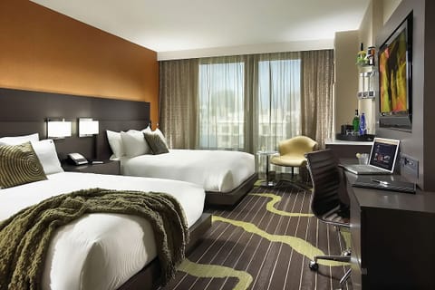 Spread out comfortably with two plush beds and bright workspace.