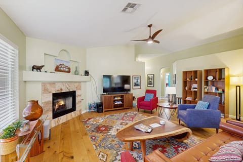 Features vaulted ceilings, plenty of seating, fireplace, and smart TV.