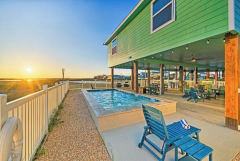 Beautiful coastal retreat with a private in-ground pool, spacious covered patio lounge, and amazing sunset views.