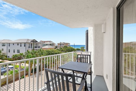 Balcony dining with partial Gulf views