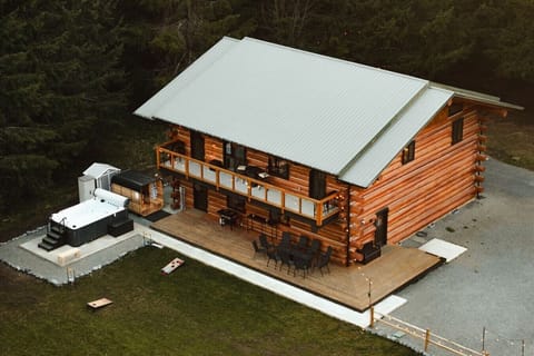 Outdoor Retreat - Expansive wraparound decking, upper balcony access, outdoor gathering areas, swim spa, sauna & peaceful forest surroundings create the ultimate mountain retreat experience.