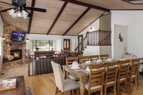 Open concept dining and living space with beautiful vaulted ceilings.