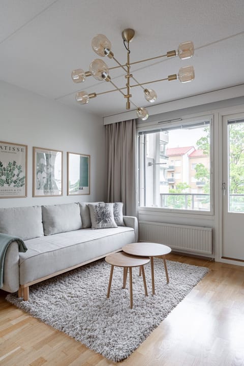 : The perfect spot to unwind. Sink into the plush sofa, enjoy the natural light, and appreciate the carefully curated modern decor
