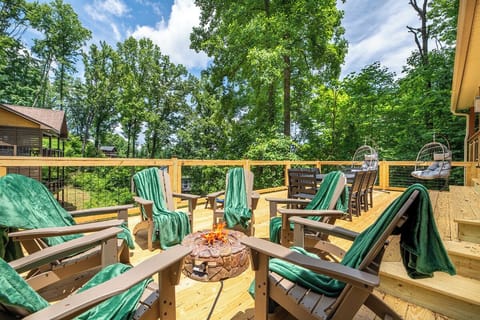Sink into cozy Adirondack chairs on your private deck, wrapped in lush forest serenity. Fire up the outdoor firepit, swing gently in the hanging chairs, and let nature surround you.