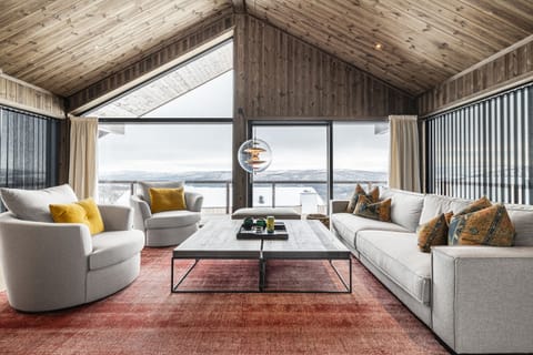 The main living room has beautiful views of the landscape outside!