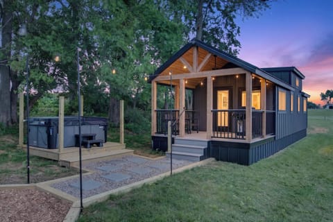 Cozy modern cabin with private hot tub and charming lit porch
