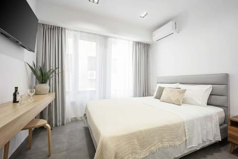 Soft daylight streams through sheer curtains, creating a peaceful bedroom atmosphere ideal for slow mornings.