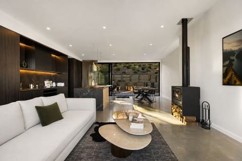 Sink into your plush sofa while the fireplace crackles, then step outside to your private dining terrace