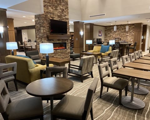 Comfortable lounge area with modern seating and fireplace.