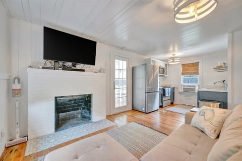 Open-concept living room with sectional seating and TV