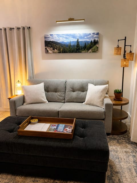 Cozy living room with comfortable seating and warm, relaxing touches.