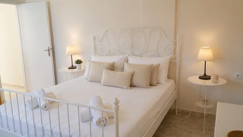 Elegant Bedroom with White Metal Bed and Soft Lighting