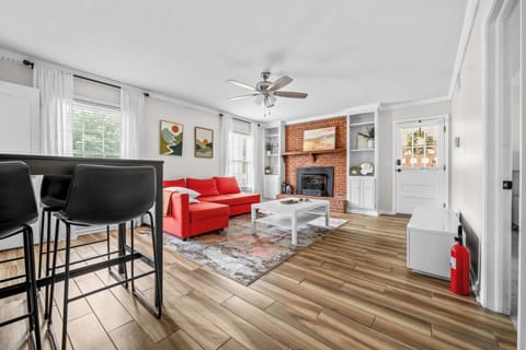 From the stunning light-wood plank flooring to the crisp white walls, this space feels completely clean, fresh, and inviting. Turn on the sleek silver ceiling fan, sink into the couch, and enjoy the open feel of your private retreat.