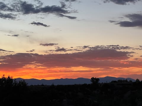 Sunset over the Jemez Mountains from front porch (portal).