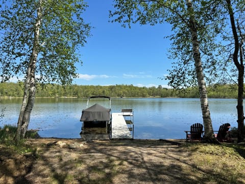 Your mornings start here: coffee on the dock, kayaks waiting, and a private no-public-access lake that belongs to your group all day. The sandy beach entry makes swimming easy for every age.