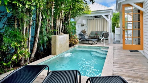 Sink into your private poolside lounge and let tropical breezes wash over you—your own shaded retreat awaits just steps away, perfect for lazy afternoons.