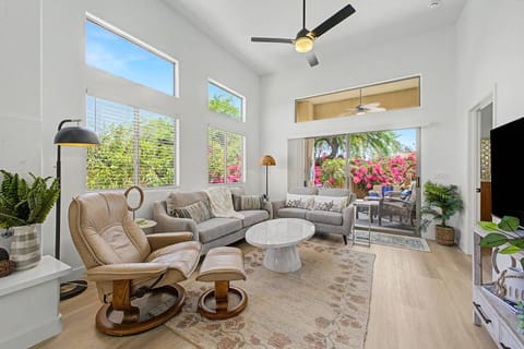 Living room with sofa, love seat, chair and 55" Smart TV with YouTube TV