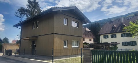 Main view of the building in summer