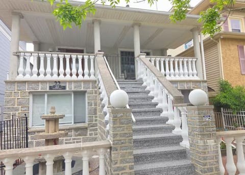 Charming elevated home with grand staircase and spacious covered porch