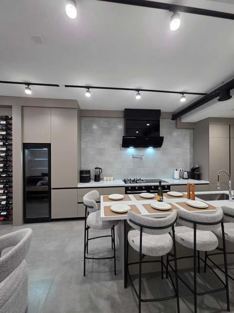 Gourmet kitchen · 8-burner range · pot filler · double fridge · wine cooler