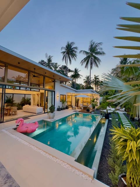 Villa Amala – luxury 3 bedroom pool villa in Koh Samui, evening view of private pool and lounge.