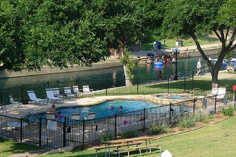 Hot tub, pool, river, picnic tables, BBQ pits, what more could you ask for?