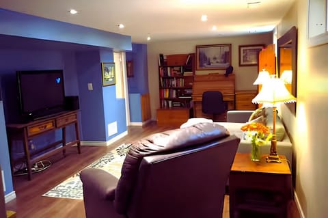 Watching TV in the Charming Basement Apartment