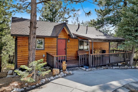 Charming log cabin with deck, forest views, and inviting mountain appeal