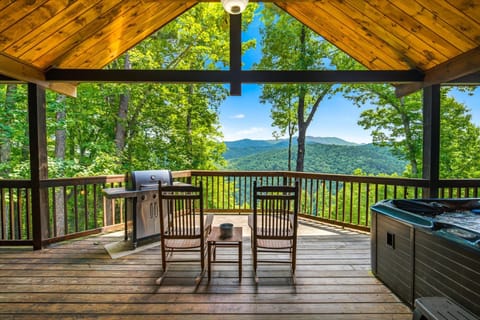 Picture yourself rocking on this covered deck with sweeping mountain views, sipping morning coffee or grilling dinner while surrounded by lush forest and fresh mountain air.