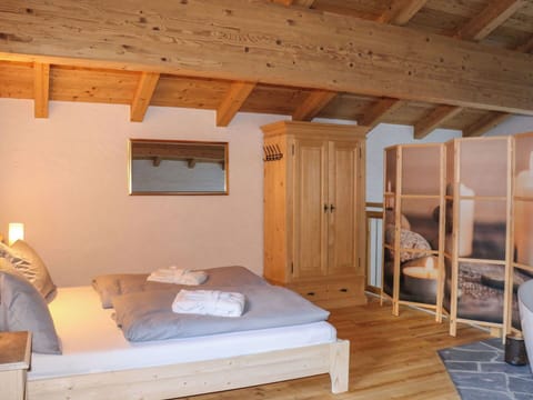 Furniture, Interior Design, Wood, Flooring, Bedroom, Floor, Bed, Ceiling, Room, Lighting