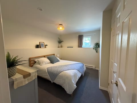 Queen size bed - with window outside.
