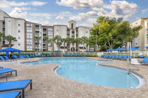 Soak up the sunshine beside expansive waters and loungers.