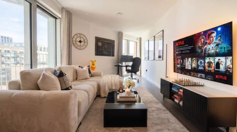 Relax in a spacious living room with stunning city views.