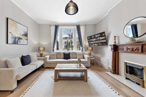 Host movie nights in the inviting living room with ample seating.