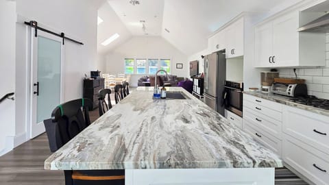 Nicely equipped kitchen with stainless appliances