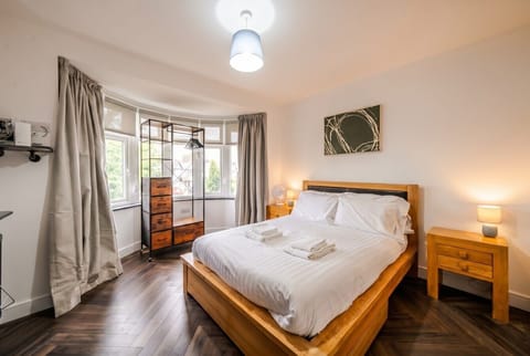 Wake up bright in this airy double with bay window and warm wood floors