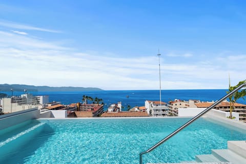 Stunning rooftop pool with panoramic views of Puerto Vallarta and the ocean.