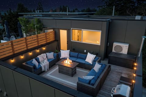 Cozy firelit evenings await on this stylish rooftop lounge.