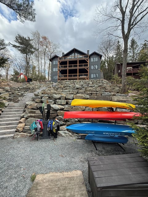 New professional photos coming in June! Available now: hot tub, private lake access with dock, outfoor furniture on all 3 decks. Boats with life jackets: 2 adult Kayak, 1 double adult kayak, 4 paddleboards. Additional boats coming in June.