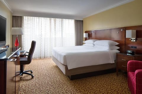 Wake up refreshed in a bright king room with space.