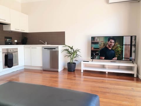 Kitchen and lounge area and 58 inch TV