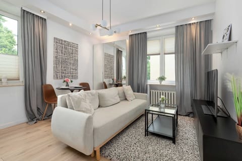 Elegant living room featuring comfortable seating, stylish décor, and plenty of natural light.