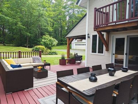 Large deck and a view of the front garden and the car garage through the front porch