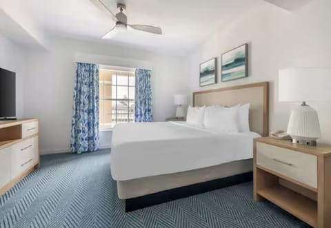 Rest deeply in a serene bedroom with soft, coastal tones.