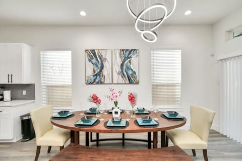The dining area effortlessly blends comfort and elegance, perfect for both intimate meals and larger gatherings.